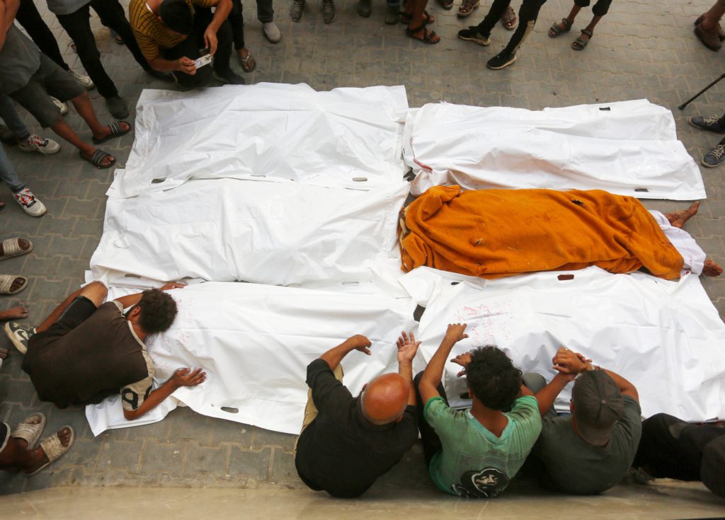 People in Gaza mourning their killed relatives after an Israeli attack.