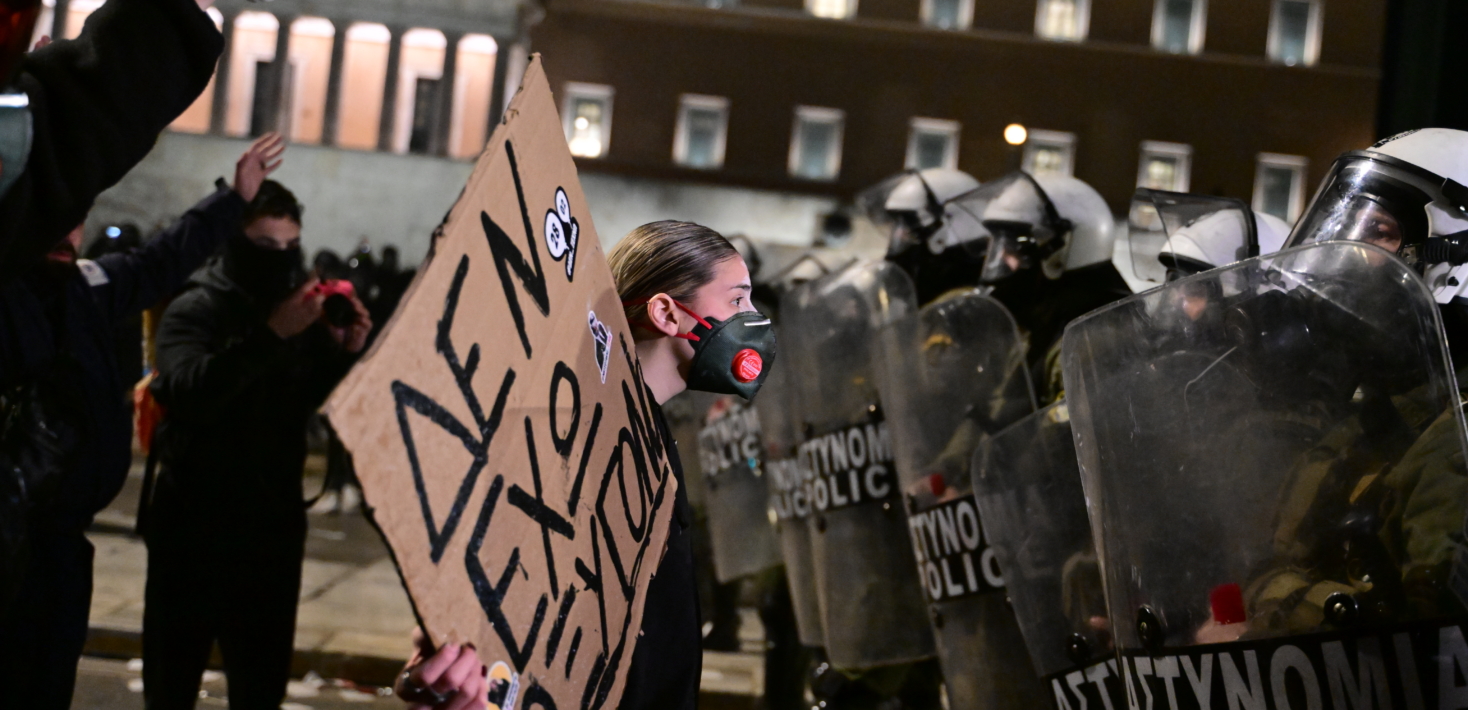 people protesting in Athens with the police present